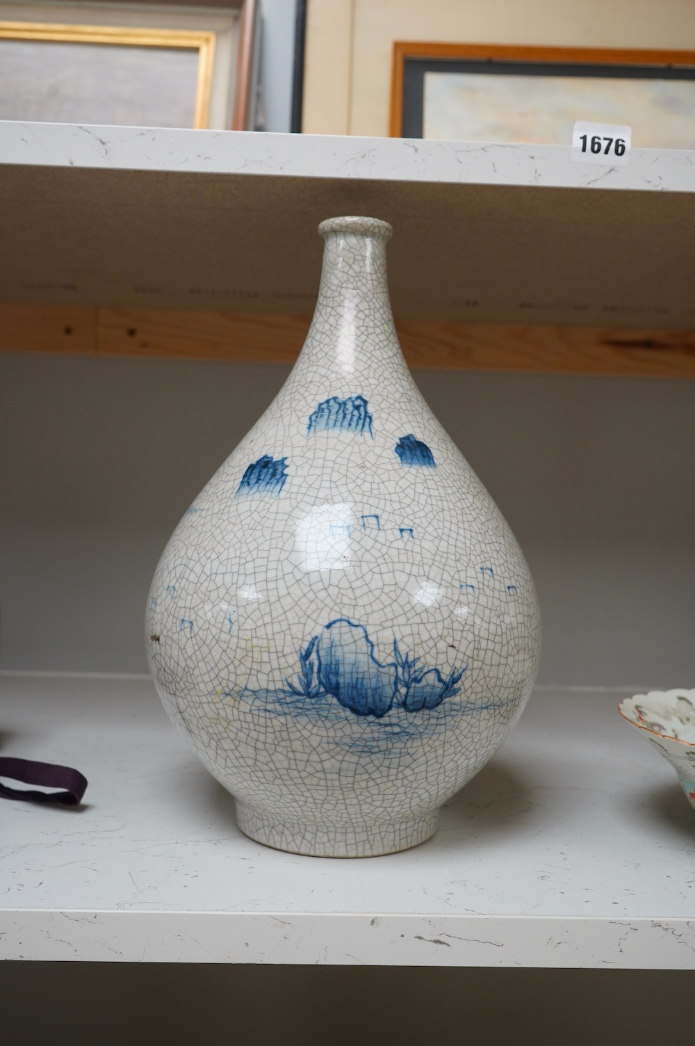 A Japanese blue and white crackle glaze bottle vase, 33cm. Condition - good